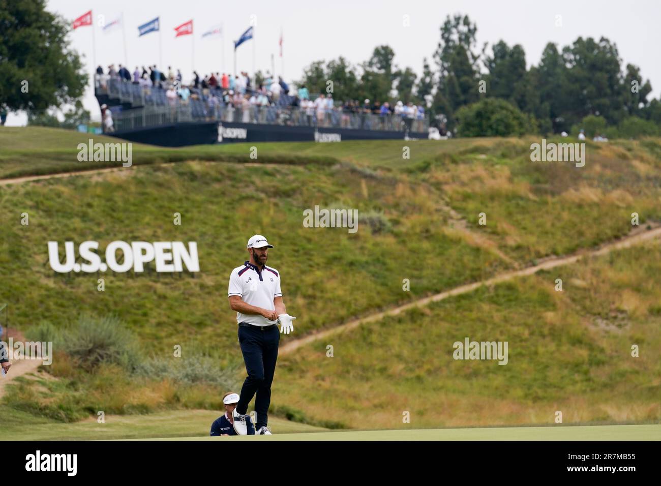 Dustin Johnson lines up a putt on the fourth hole during the second round of the U.S