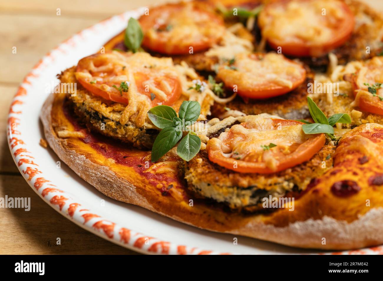 Home made vegan breaded eggplant pizza. Stock Photo