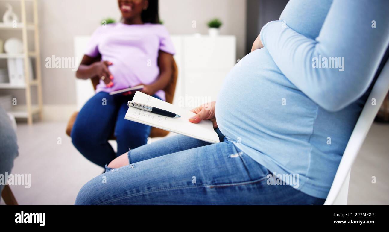 Pregnant Expecting Women Group Class. Pregnancy And Maternity Stock