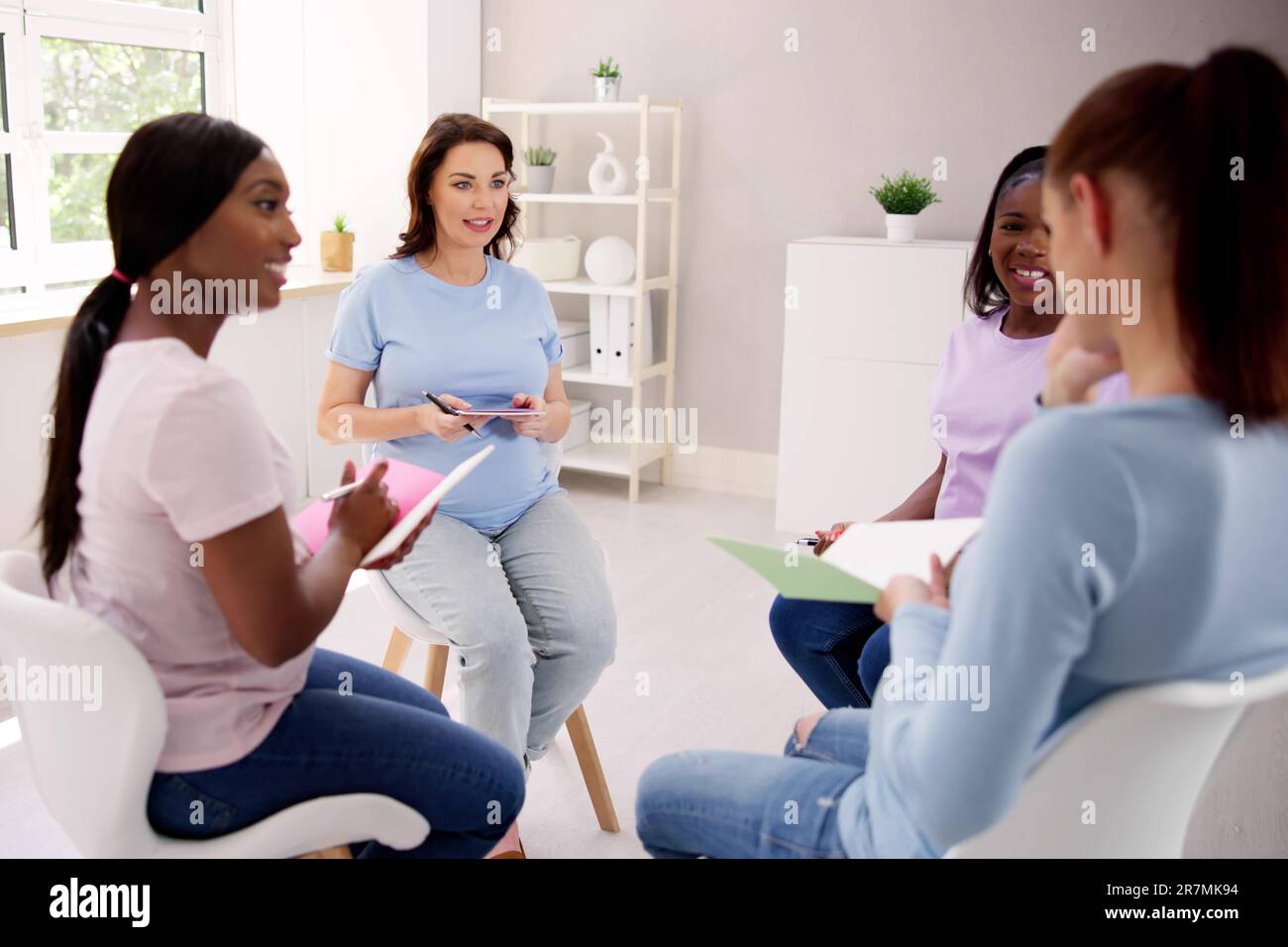 Pregnant Expecting Women Group Class. Pregnancy And Maternity Stock