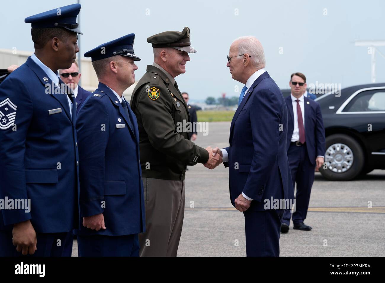 President Joe Biden shakes hands with Brig. Gen. Ralph F. Hedenberg ...