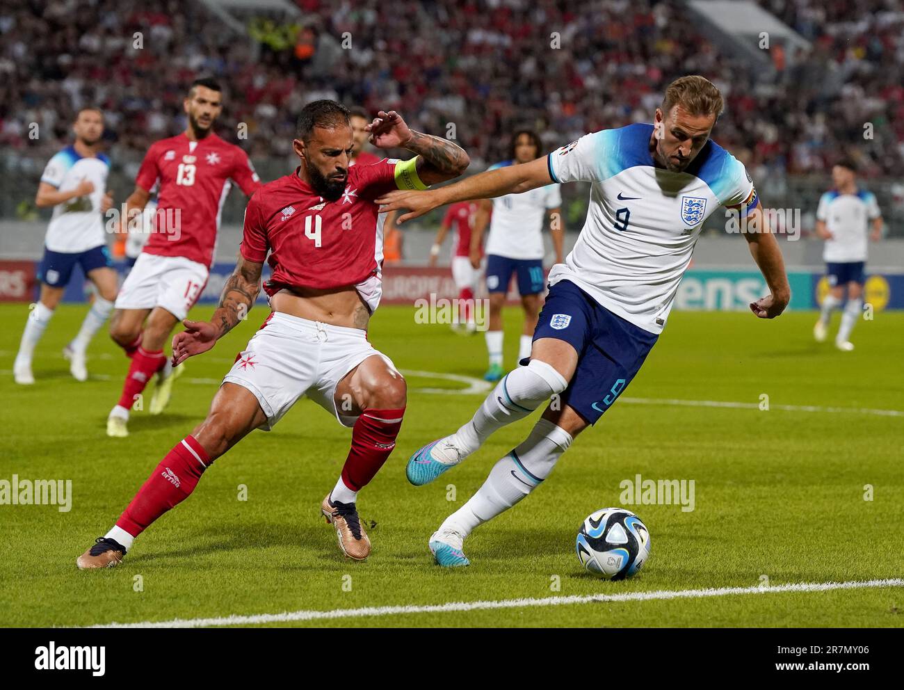 Malta's Steve Borg (left) And England's Harry Kane Battle For The Ball 