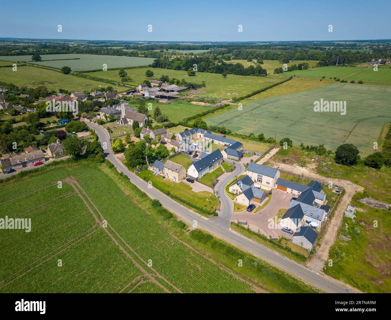 16th June 2023 Arial view of what was a farmyard, the existing granary and large barn have been converted to house and new house built on the rest of the yard Stock Photo