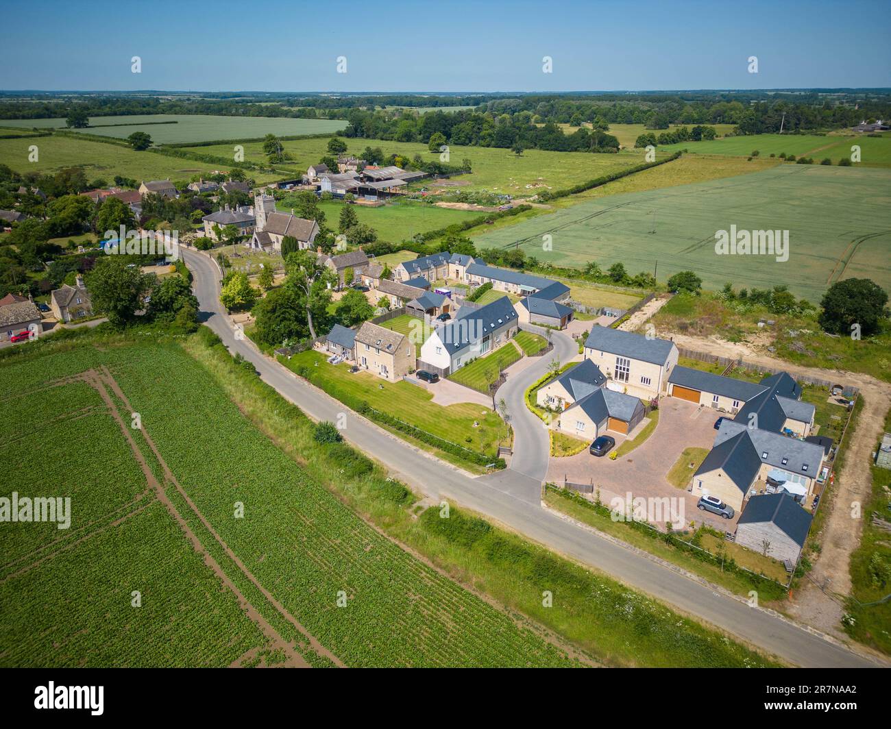 16th June 2023 Arial view of what was a farmyard, the existing granary and large barn have been converted to house and new house built on the rest of the yard Stock Photo