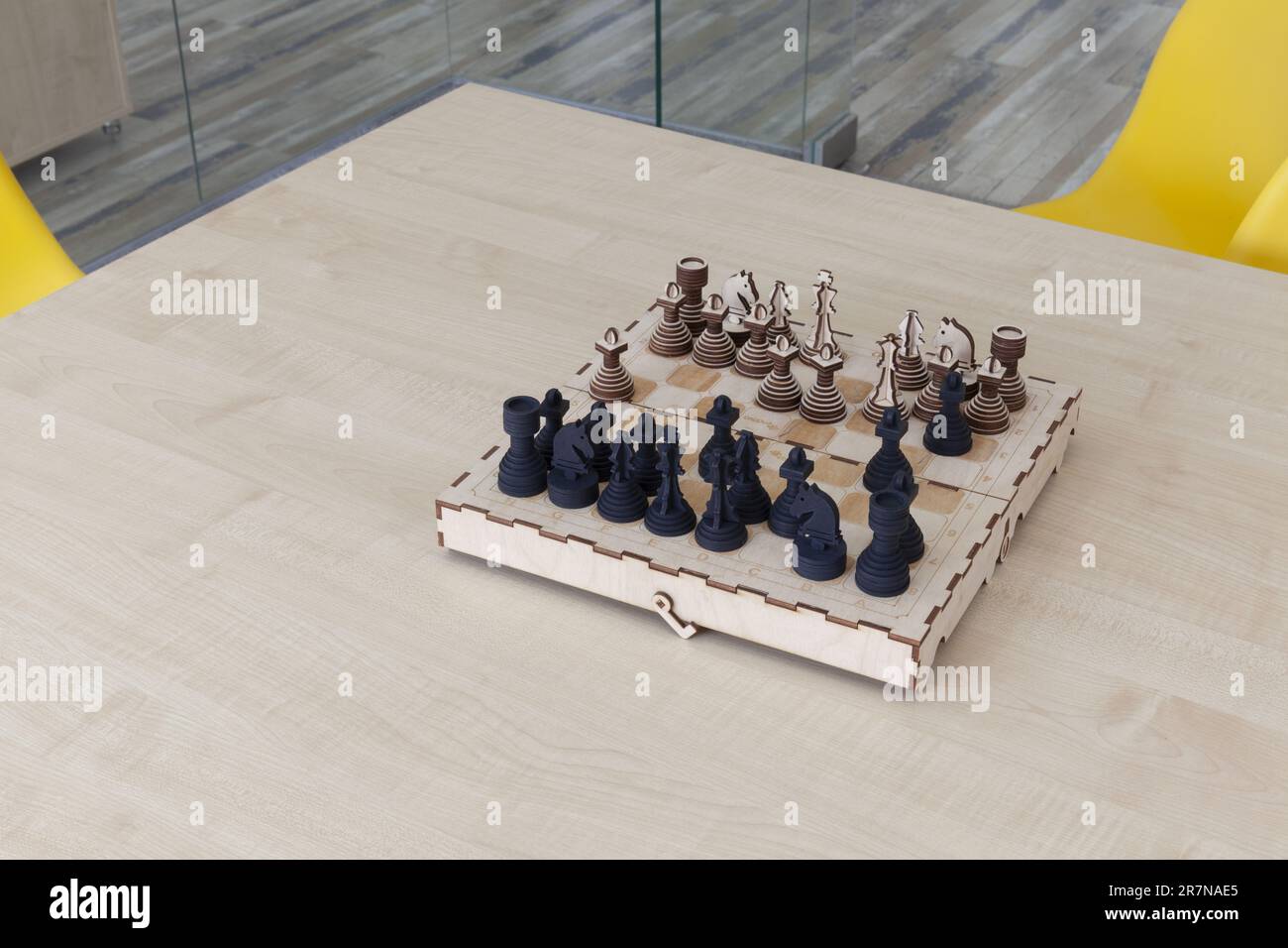 wooden chess on a wooden table, close up Stock Photo
