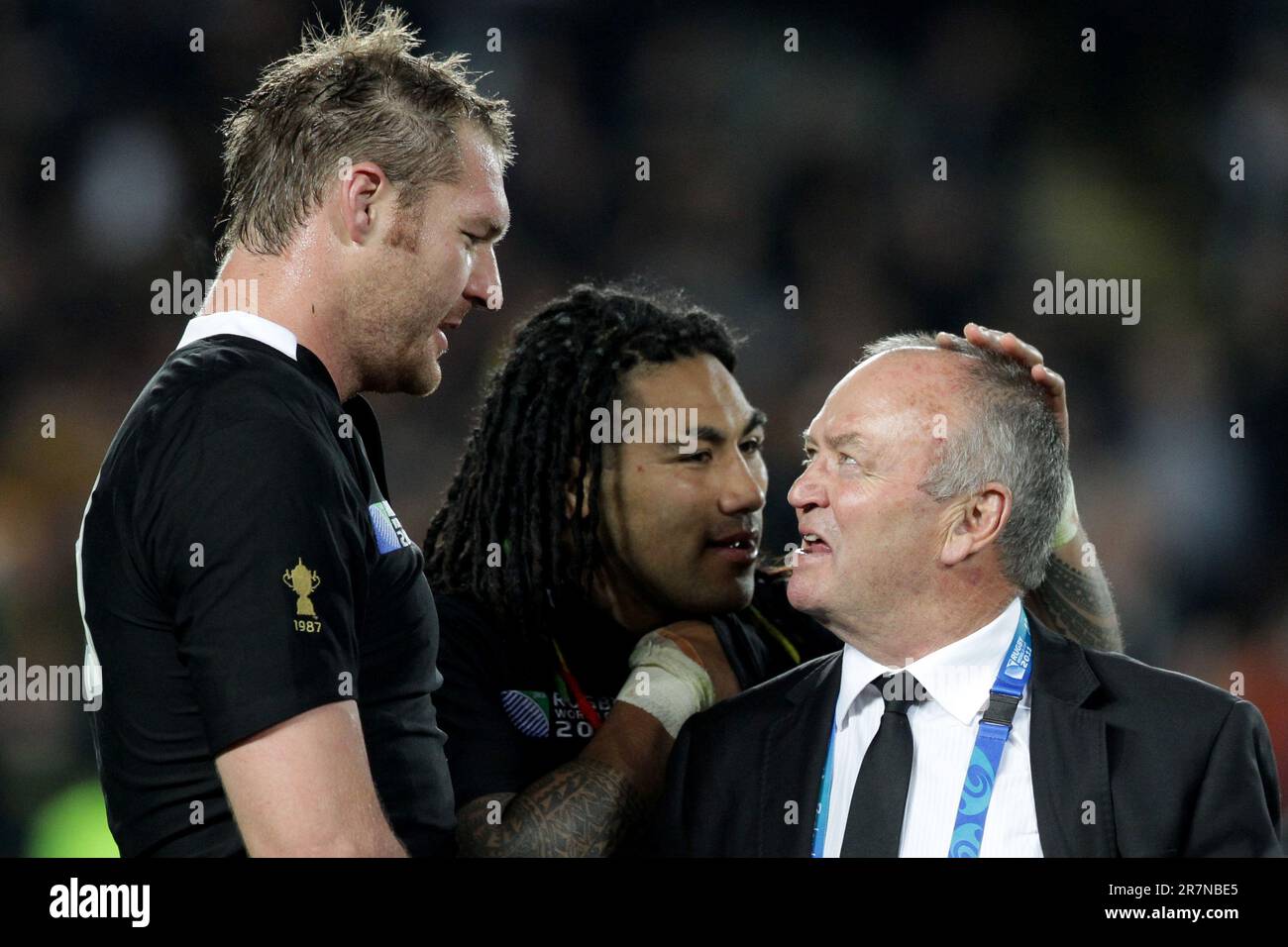 New Zealand’s Ali Williams, left, and Ma'a Nonu with head coach Graham Henry after defeating Australia in the second semi-final match of the Rugby World Cup 2011, Eden Park, Auckland, New Zealand, Sunday, October 16, 2011. Stock Photo