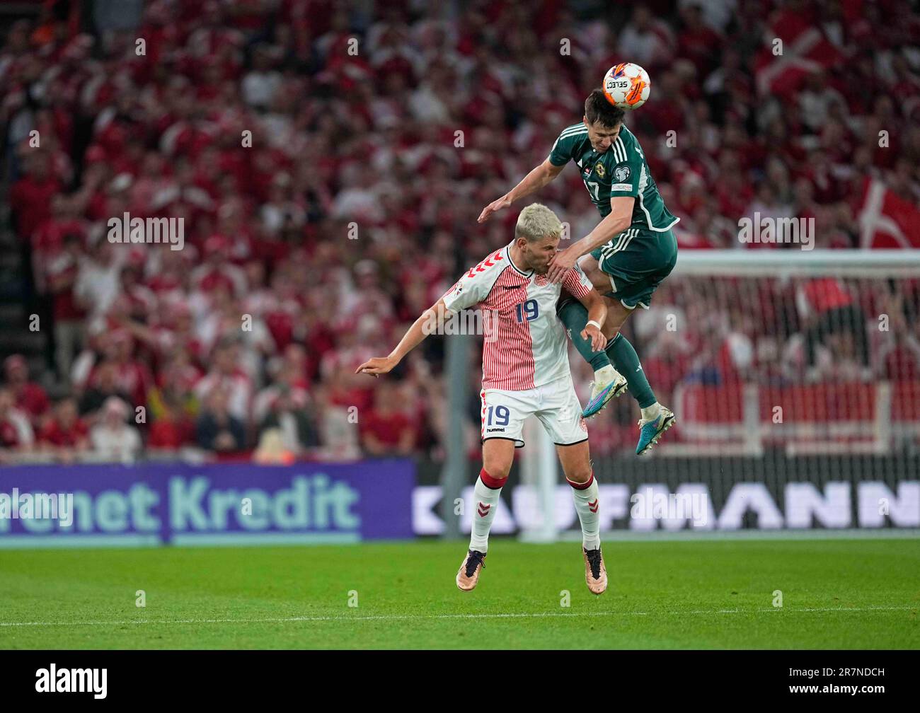 Parken, Copenhagen, Denmark. 16th June, 2023. Jonas Wind (Denmark) and Paddy McNair (Northern Ireland) battle for the ball during a UEFA European Championship Qualification 2023/2024 Group H game, Denmark vs Northern Ireland, at Parken, Copenhagen, Denmark. Kim Price/CSM/Alamy Live News Stock Photo