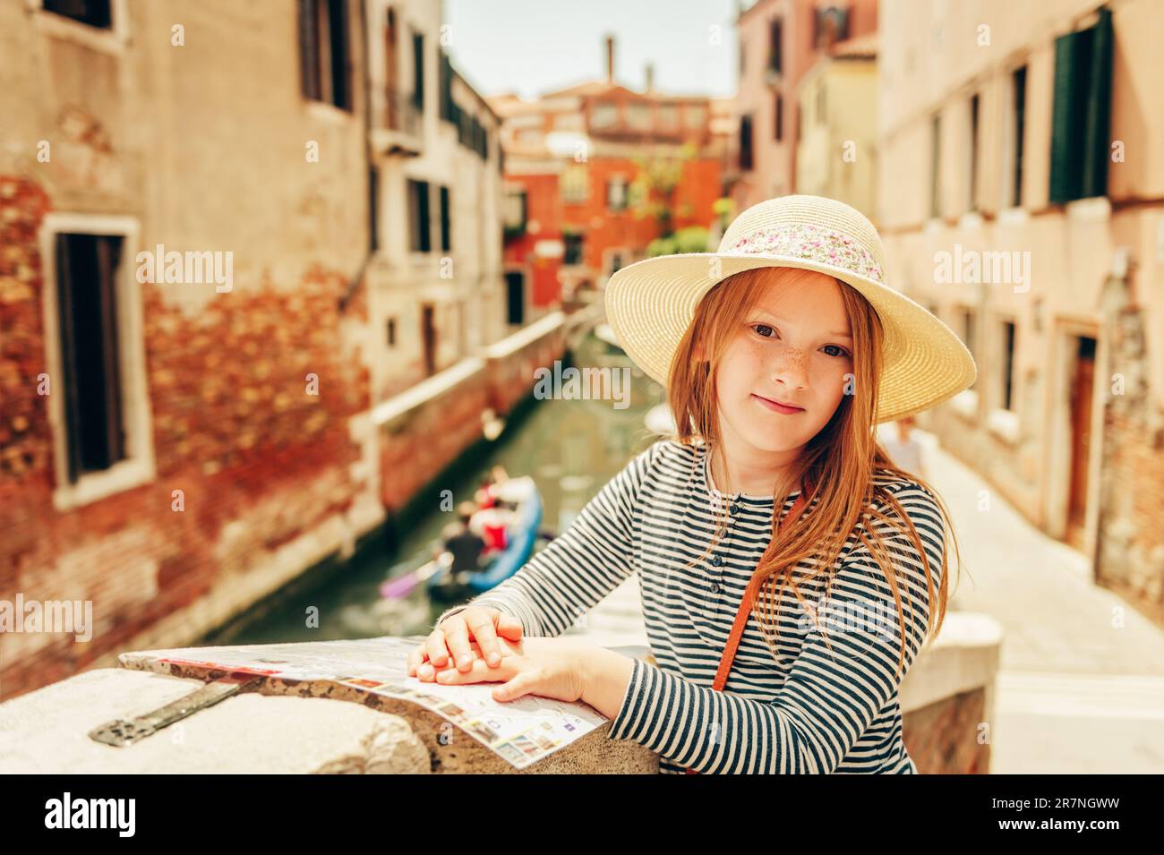 Little girl playing on the streets of Venice. Family travel with children Stock Photo