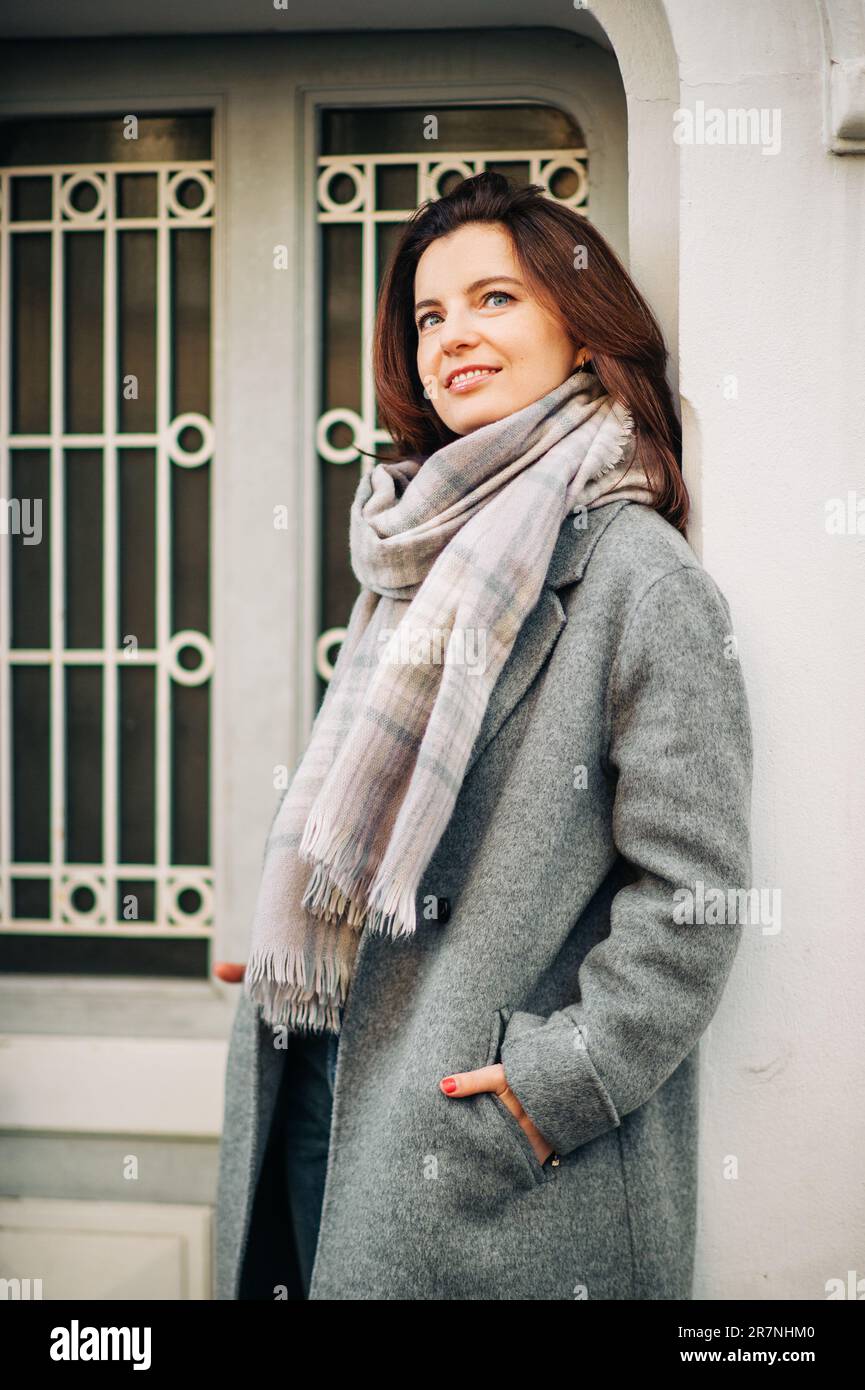 Outdoor portrait of beautiful woman wearing grey coat Stock Photo - Alamy
