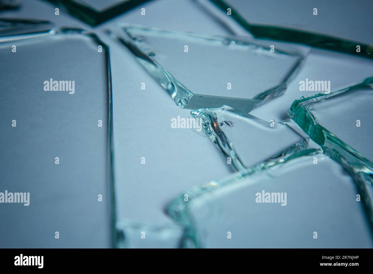 Broken glass pile pieces of texture and background isolated on white