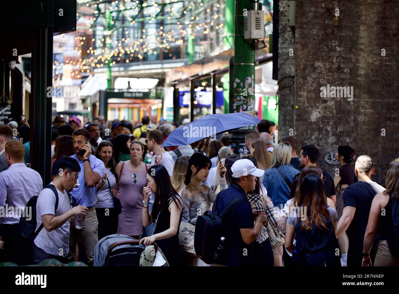 Hustle and Bustle of Borough Market visitors and stall holders, London Stock Photo