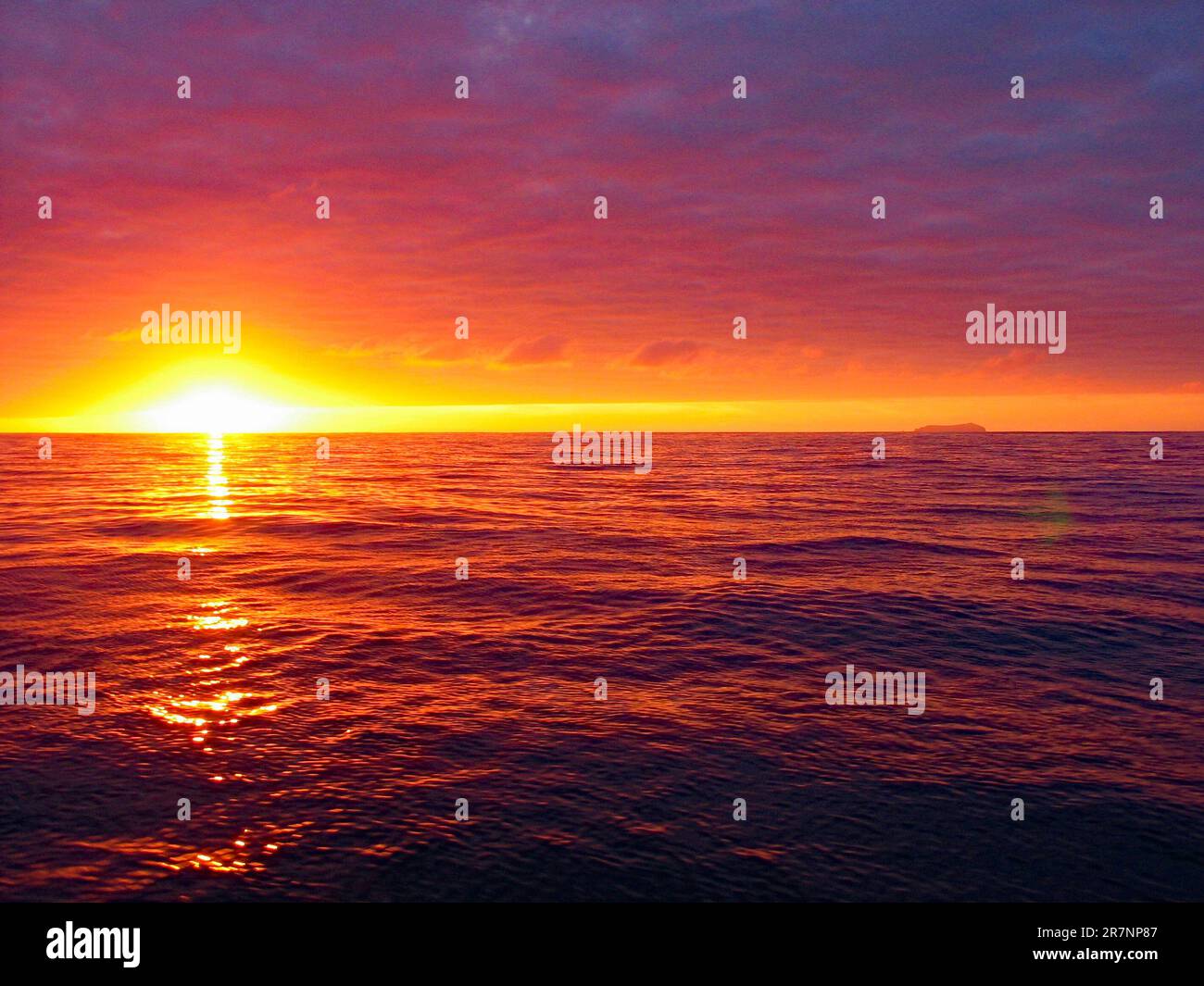 Wolf Island (Wenman Island), Galapagos, view at sunset from a boat crossing the Pacific Ocean (authentic colors, no filtration) Stock Photo