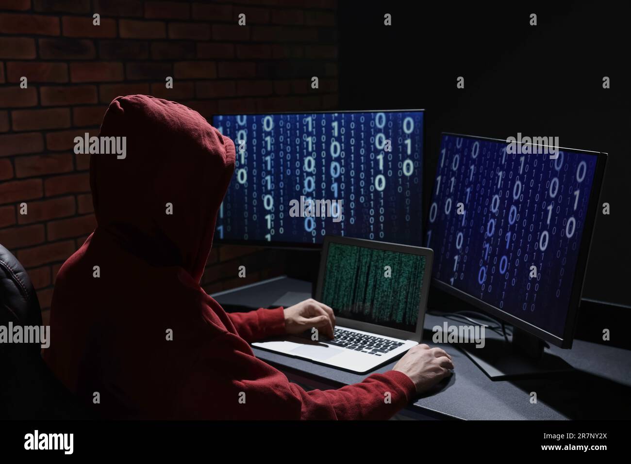 Hacker working with computers in dark room. Cyber attack Stock Photo