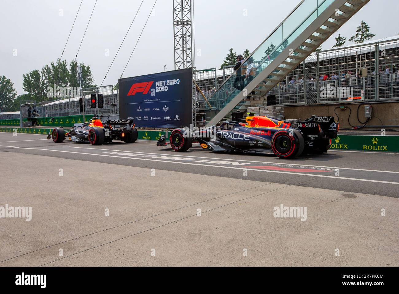 Max Verstappen (NED) Redbull Racing RB19 and  Sergio Perez (MEX) Redbull Racing RB19 exiting pitlane during day2, Friday,  of FORMULA 1 PIRELLI GRAND Stock Photo