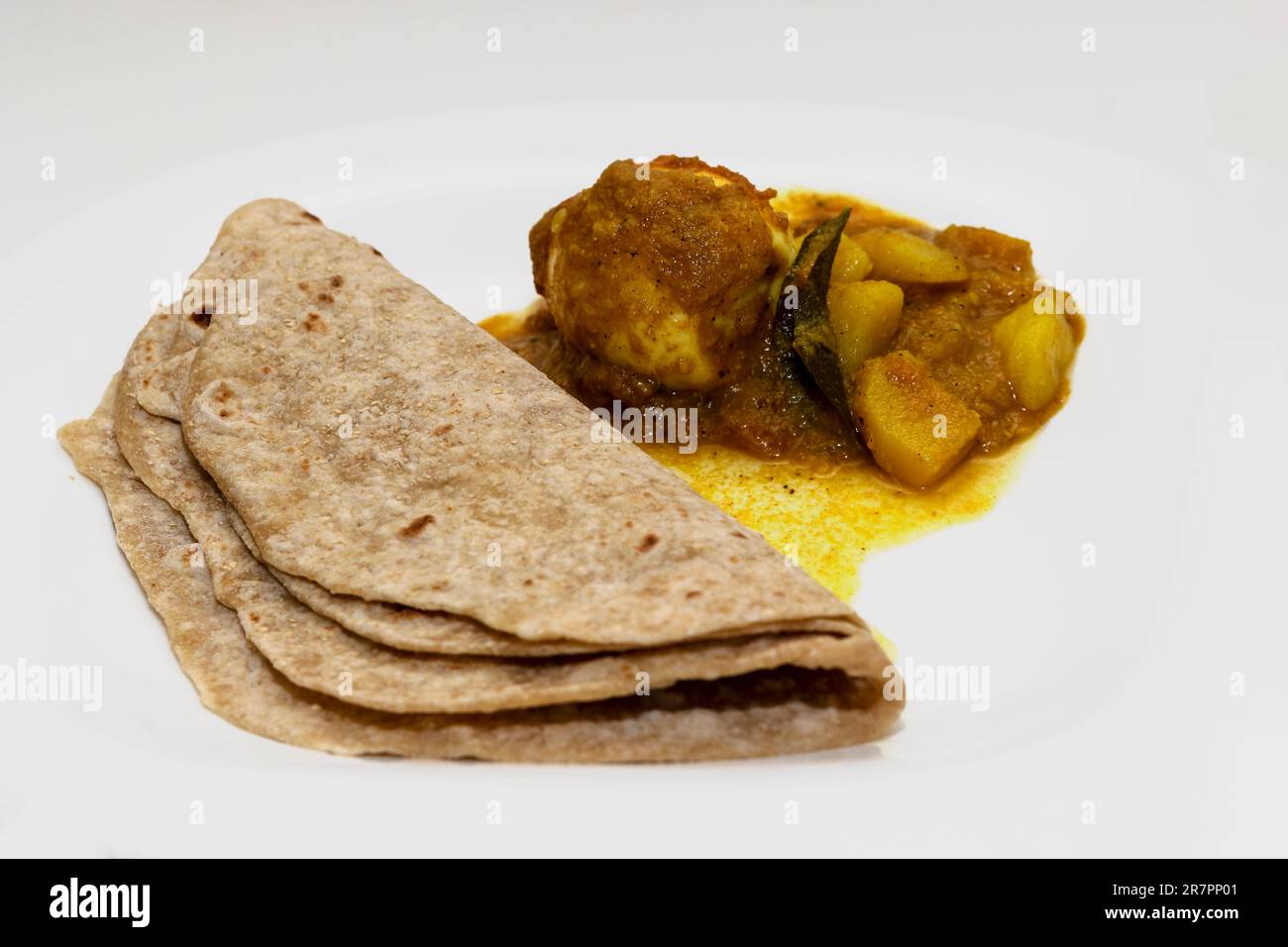 Closeup Image Of Chapati With Egg Curry. Isolated Background Stock Photo