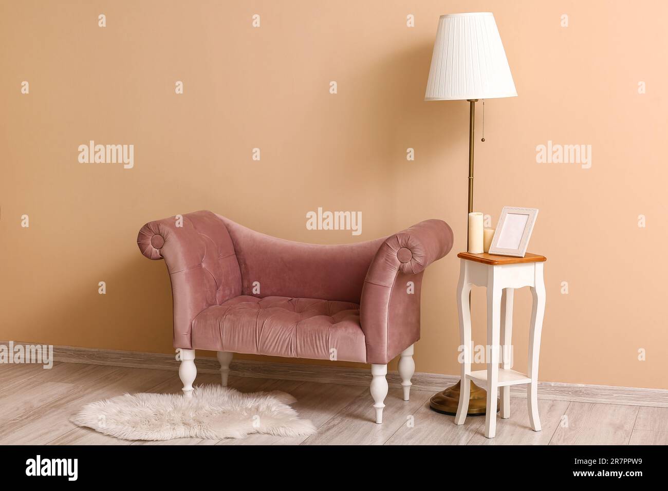 Interior of living room with armchair, lamp and table Stock Photo - Alamy