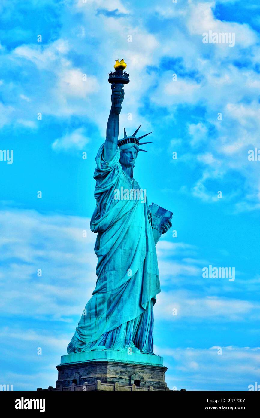 The iconic Statue of Liberty stands prominently against a backdrop of