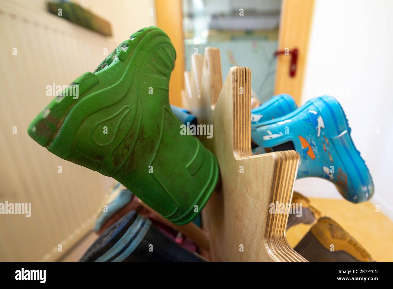 03 June 2023, Saxony, Großenhain: Several boots hang symbolically on a ...