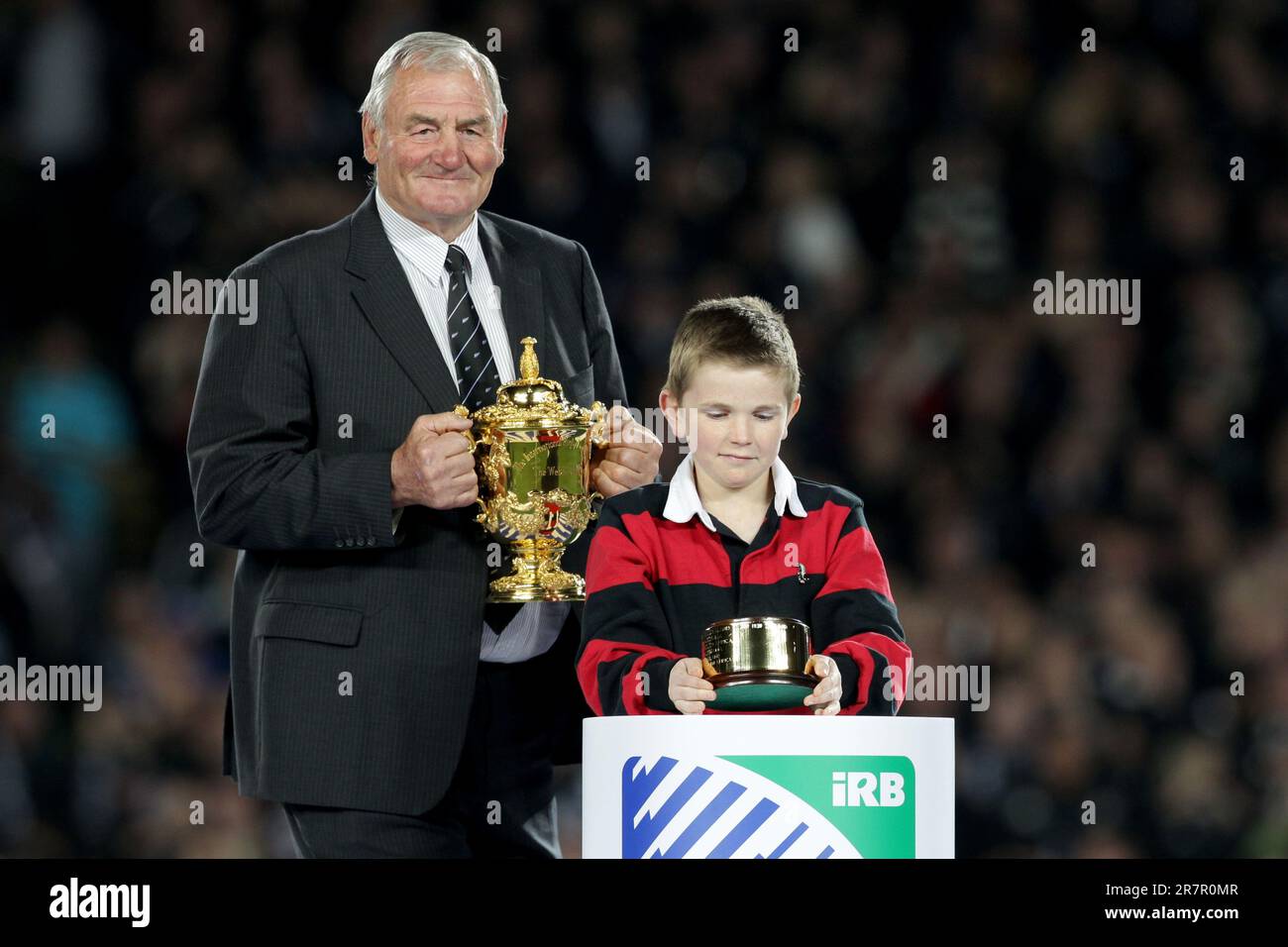 Sir Brian Lochore places the Rugby World Cup onto the plinth before presentation to New Zealand for defeating France in the Rugby World Cup final at Eden Park, Auckland, New Zealand, Sunday, October 23, 2011. Stock Photo