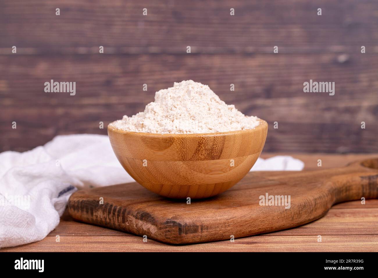 Mahlep powder on wooden background. Mahlep powder in wooden bowl Stock Photo