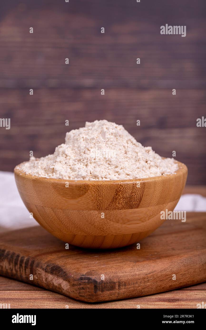 Mahlep powder on wooden background. Mahlep powder in wooden bowl. Close up Stock Photo