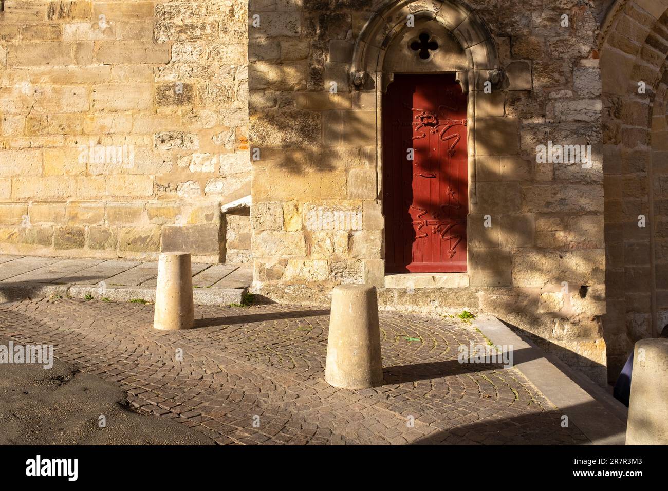 A close view of one of the red doors of the Cahors's cathedral, taken at the end of the afternoon, with no people Stock Photo