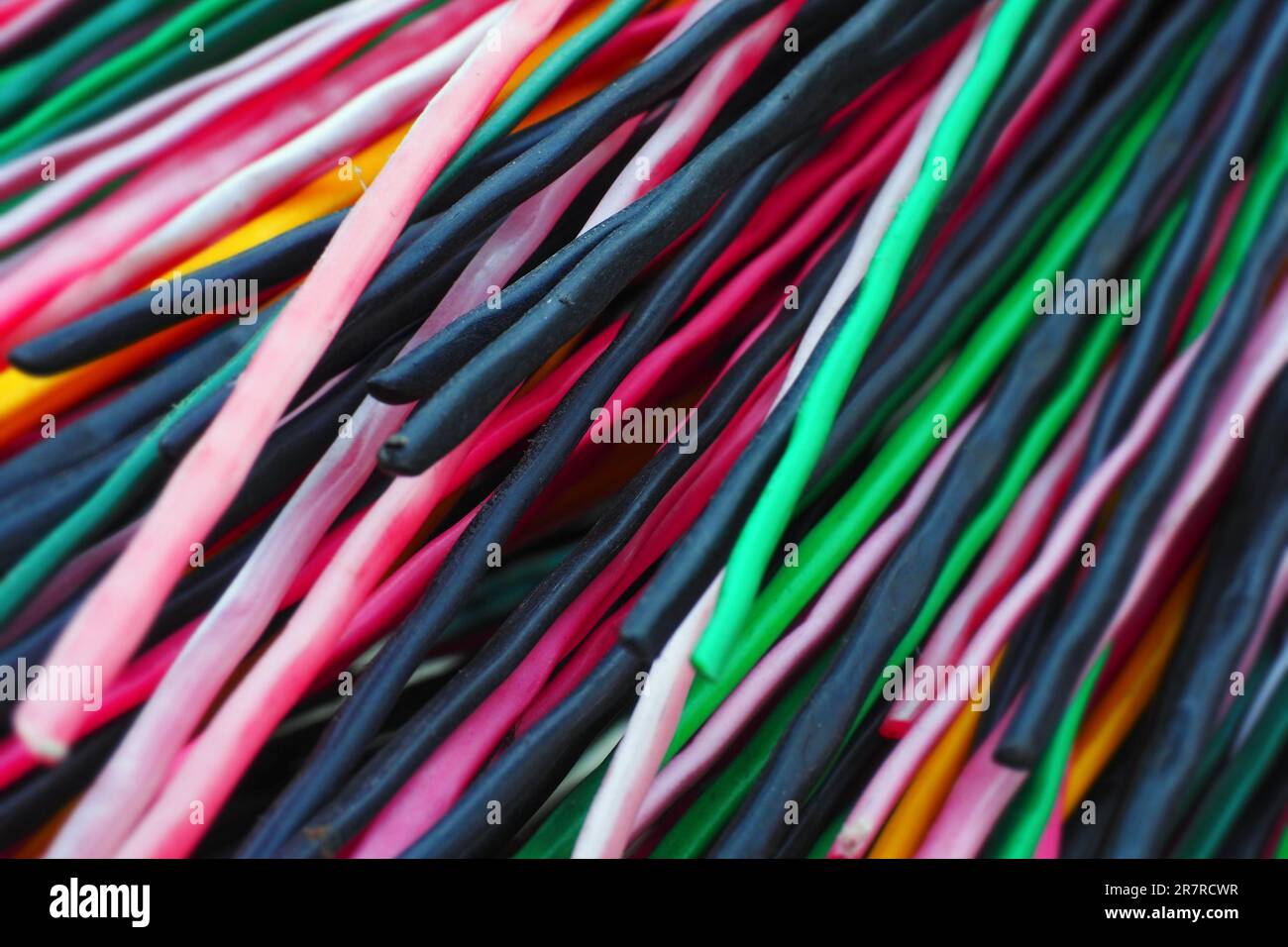 Multicolored plastic rods for recycling and recyclables. Background in
