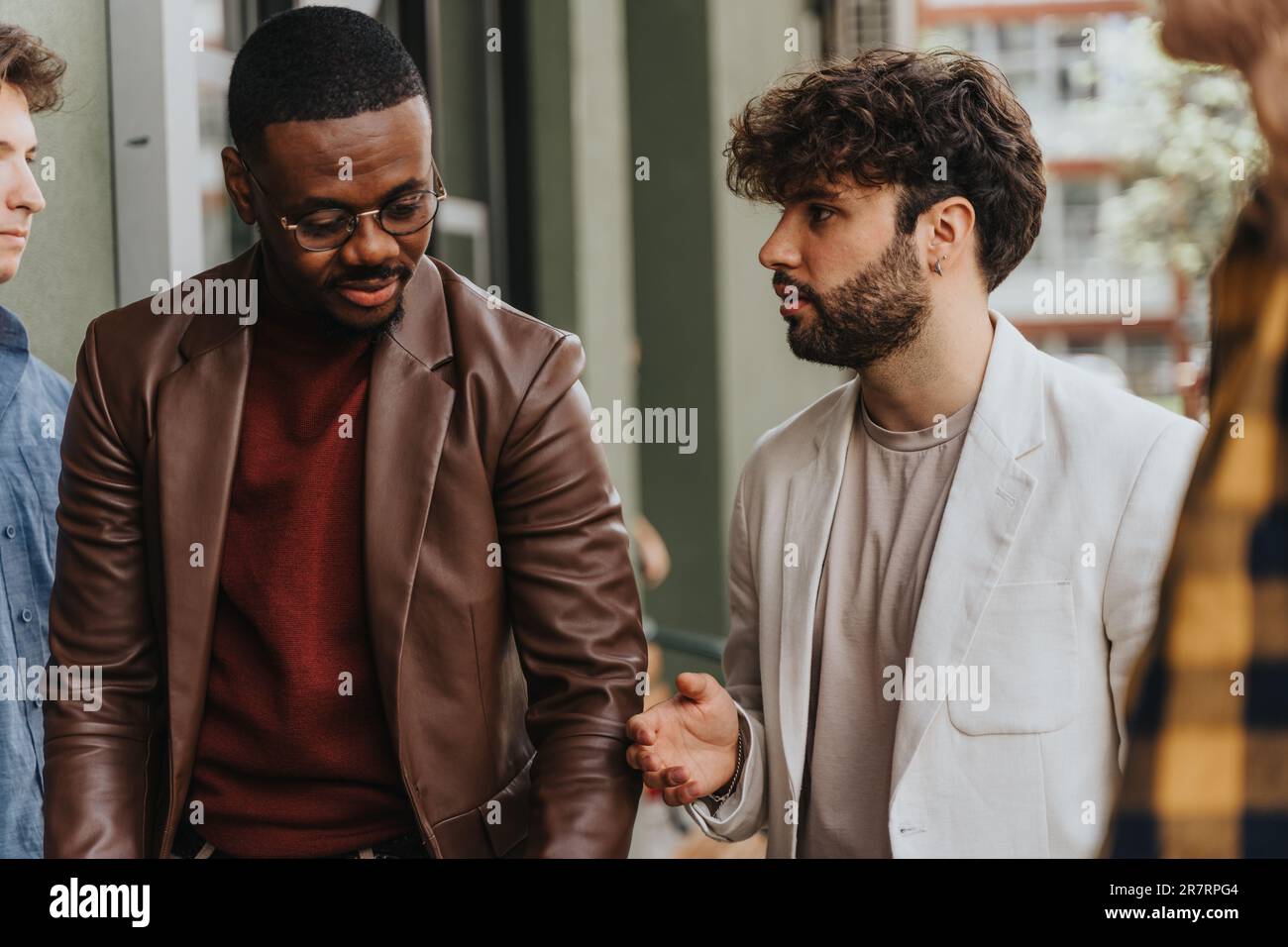 Two business partners having a project conversation while taking a break from work Stock Photo