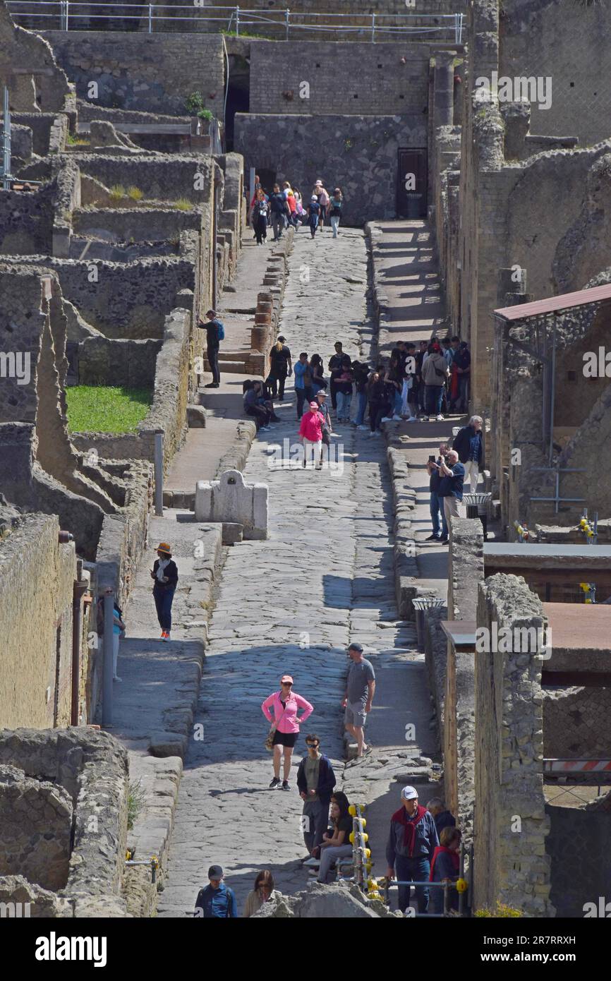 Tourists viewing the preserved Roman town of Herculaneumm buried in the ...