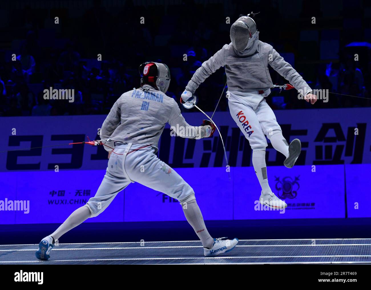 Wuxi. 17th June, 2023. Iran's Ali Pakdaman (L) competes with Kim Junho