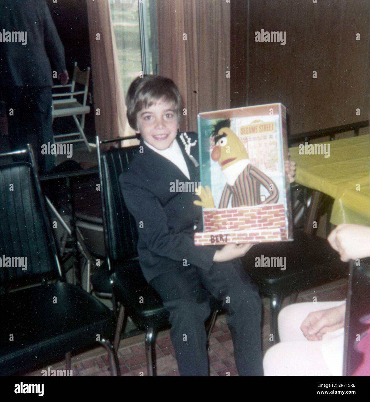 Young boy getting a Sesame Street Bert puppet doll as a present in 1972 Stock Photo