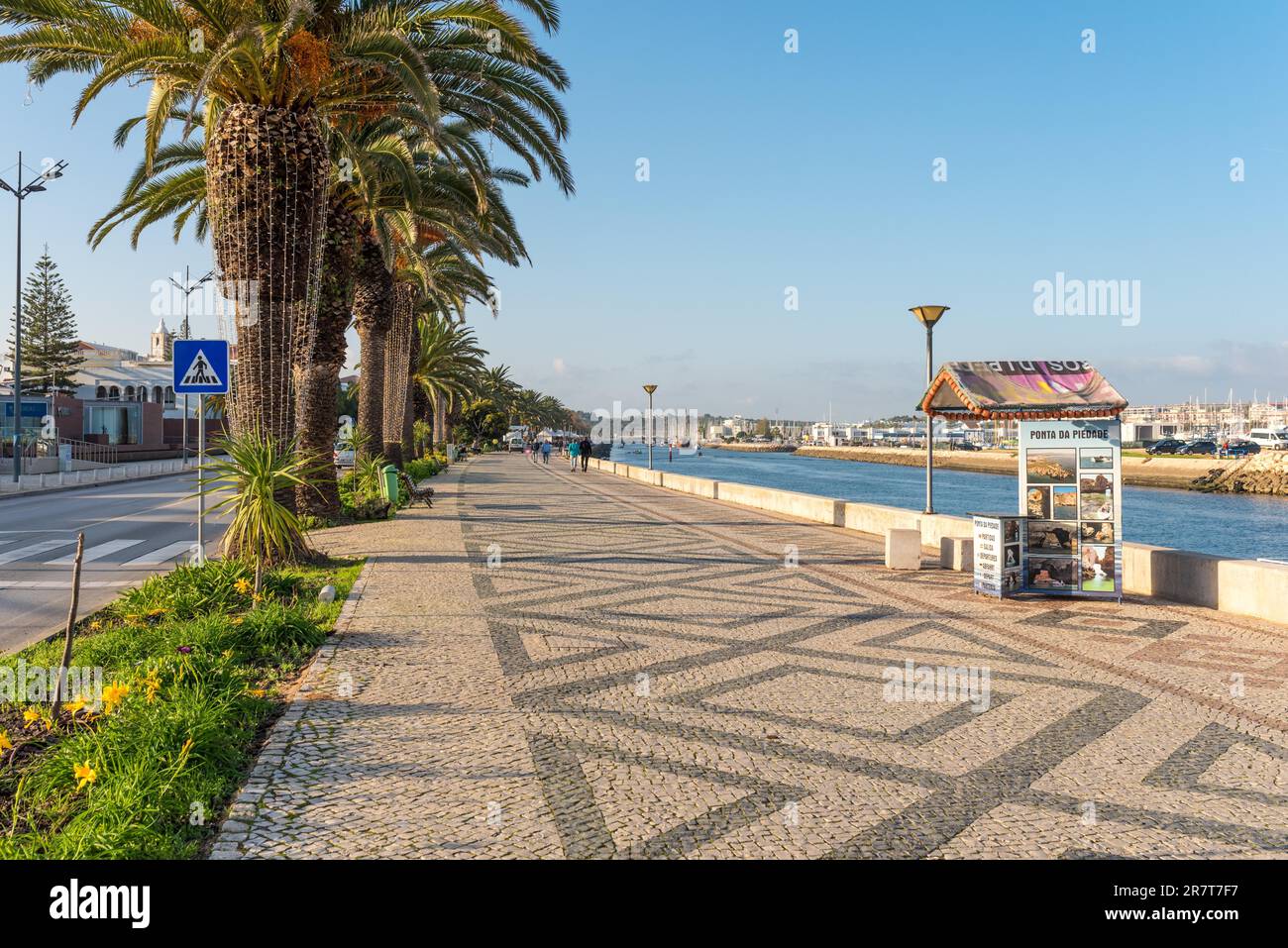 The river promenade in Lagos. Stroll along the Bensafrim river to the marina of the town Stock Photo