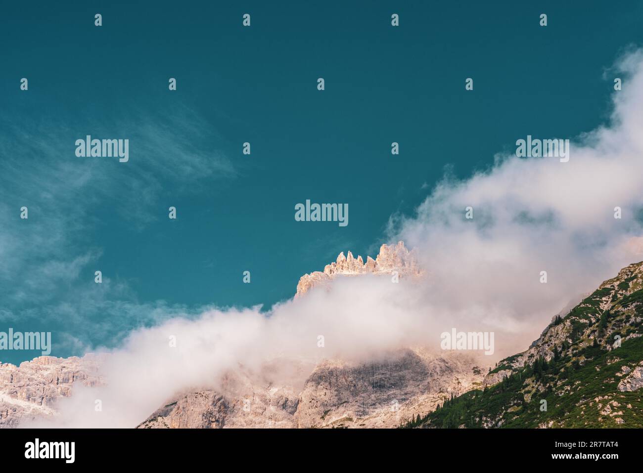 Clouds over mountain peaks in the Dolomites, Italy Stock Photo - Alamy