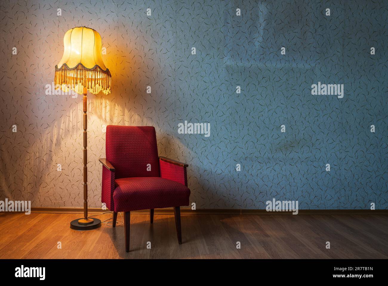 Old floor lamp and old armchair in a room. Old house Stock Photo - Alamy