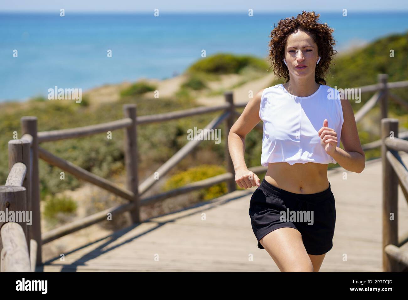 Woman jogging in the park  Women, Jogging, Girl short hair