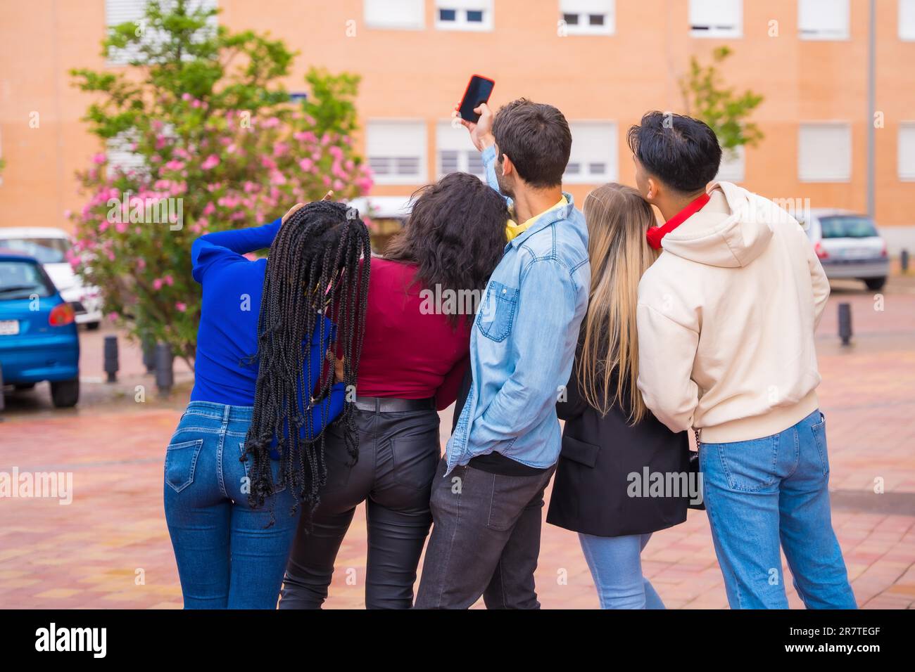 Group of multi ethnic friends walking through the university campus ...