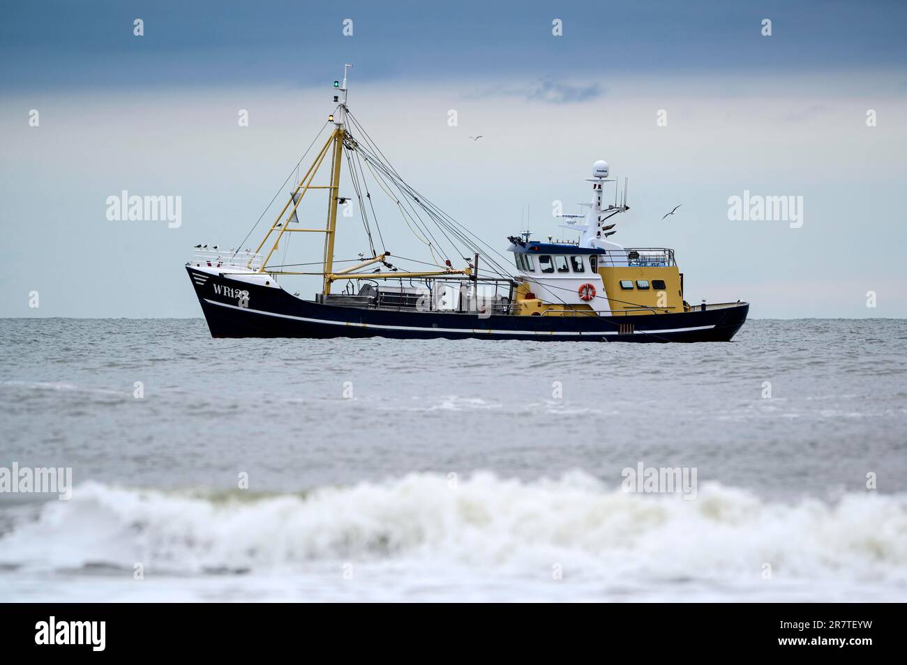 Shrimper, crabber near beach, with surf, Texel Island, North Sea, North Holland, Netherlands Stock Photo