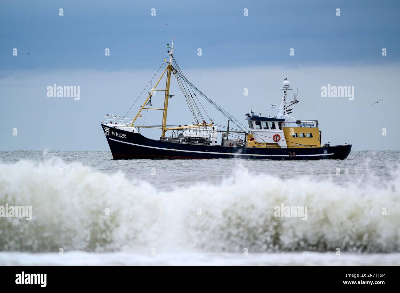 Shrimper, crabber near beach, with surf, Texel Island, North Sea, North Holland, Netherlands Stock Photo