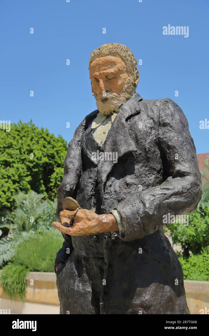 Sculpture and monument to French writer Victor Hugo by Ousmane Sow, Esplanade des Droits de l'Homme, detail, face, view, pocket watch, Besancon Stock Photo