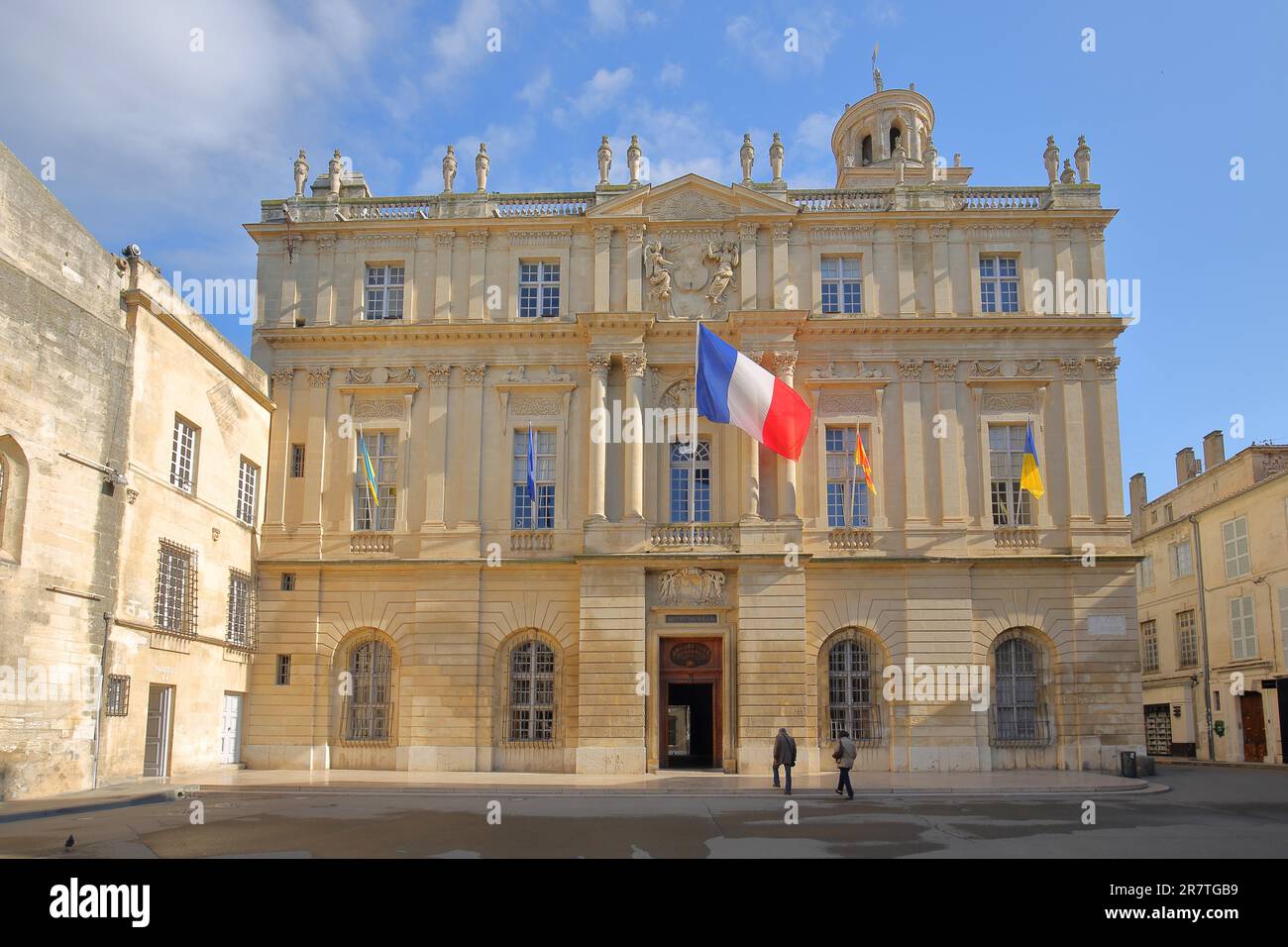 Hotel de Ville with French National Flag, City Hall, at Place de la Republique, Imperial Square, Arles, Bouches-du-Rhone, Camargue, Provence Stock Photo