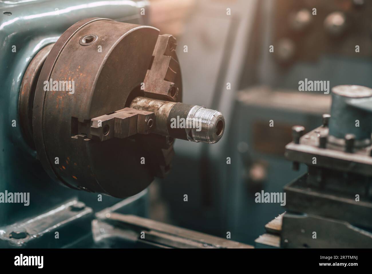Old Precision CNC Lathe Machine Rotor Milling in Heavy Metal Factory. Stock Photo