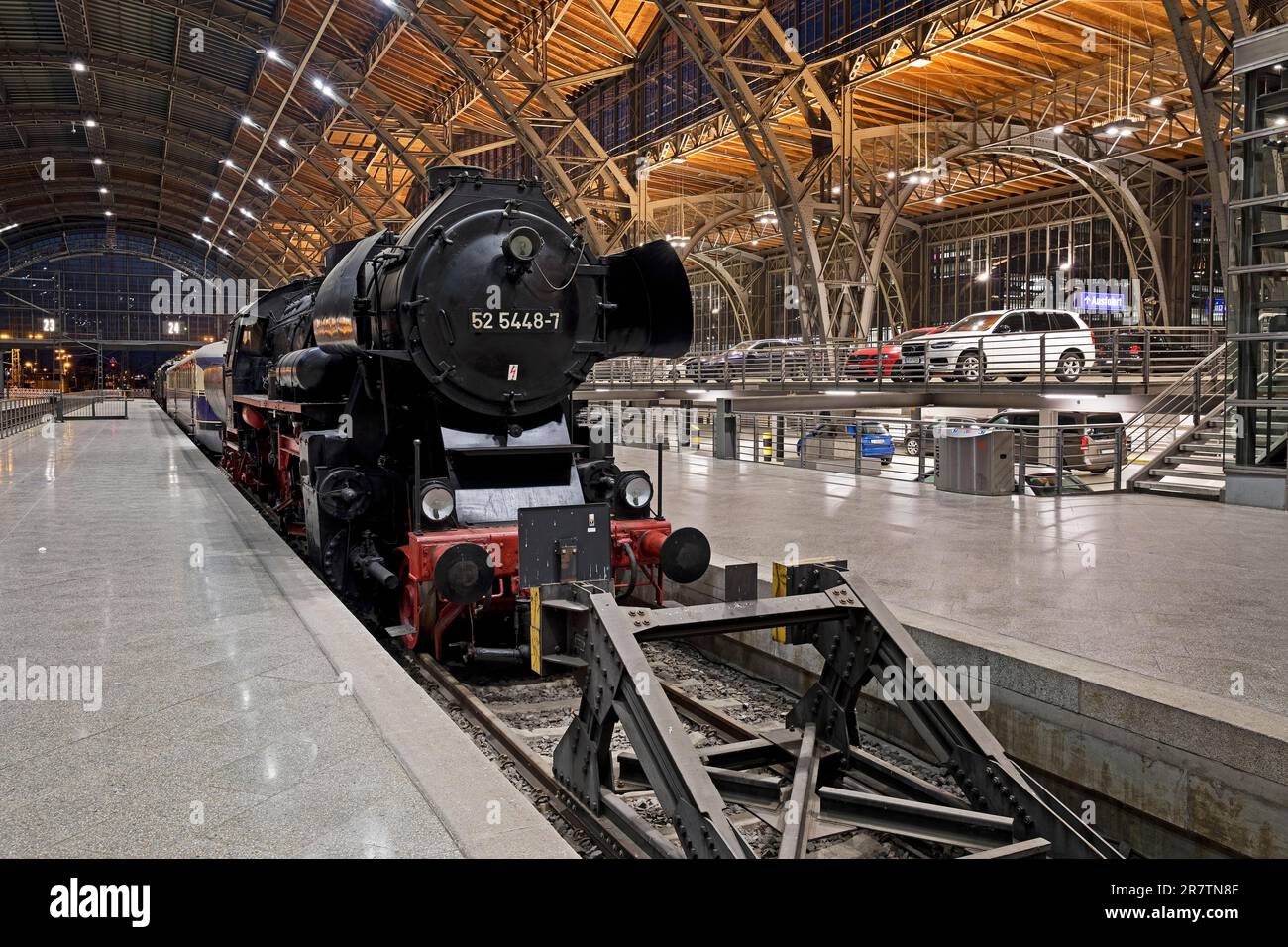 Steam locomotive on museum track 24 as a visual separation from the car parking spaces in the main station, Leipzig, Saxony, Germany Stock Photo