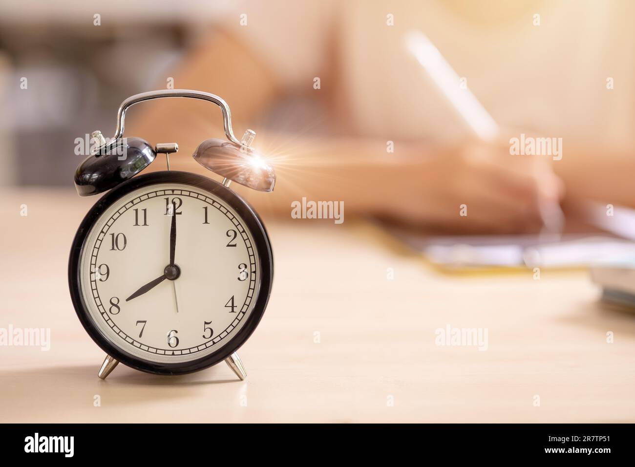 Education alarm times clock School student learning study writing at the morning blur background. Stock Photo