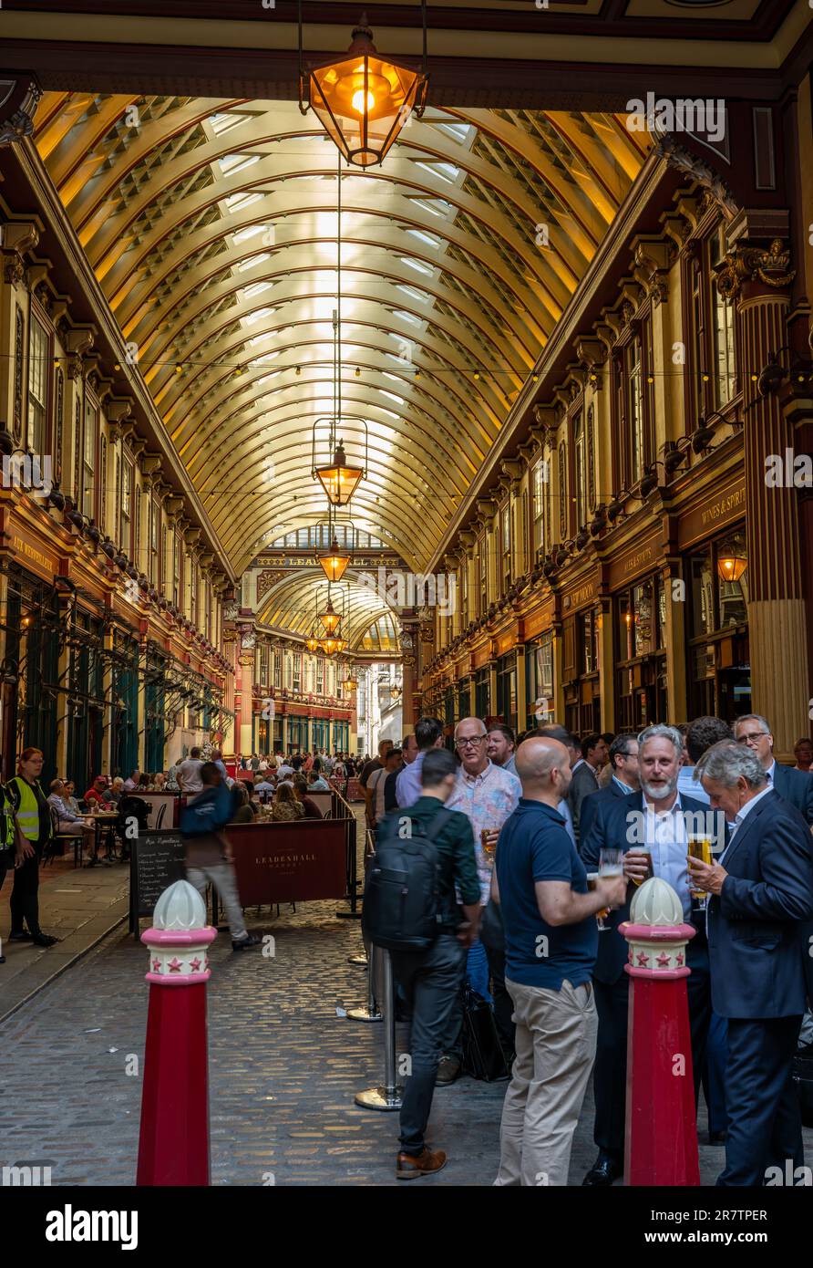 London, UK: The old Leadenhall Market in the City of London. People enjoy a drink on a summer's evening after work. Stock Photo