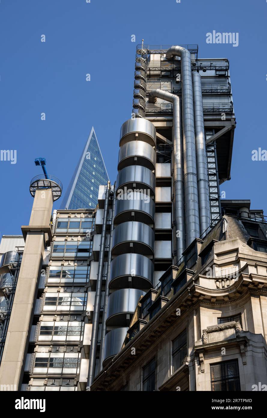 London UK The Lloyds Of London Building With The Pointed Spire Of The london-uk-the-lloyds-of-london-building-with-the-pointed-spire-of-the