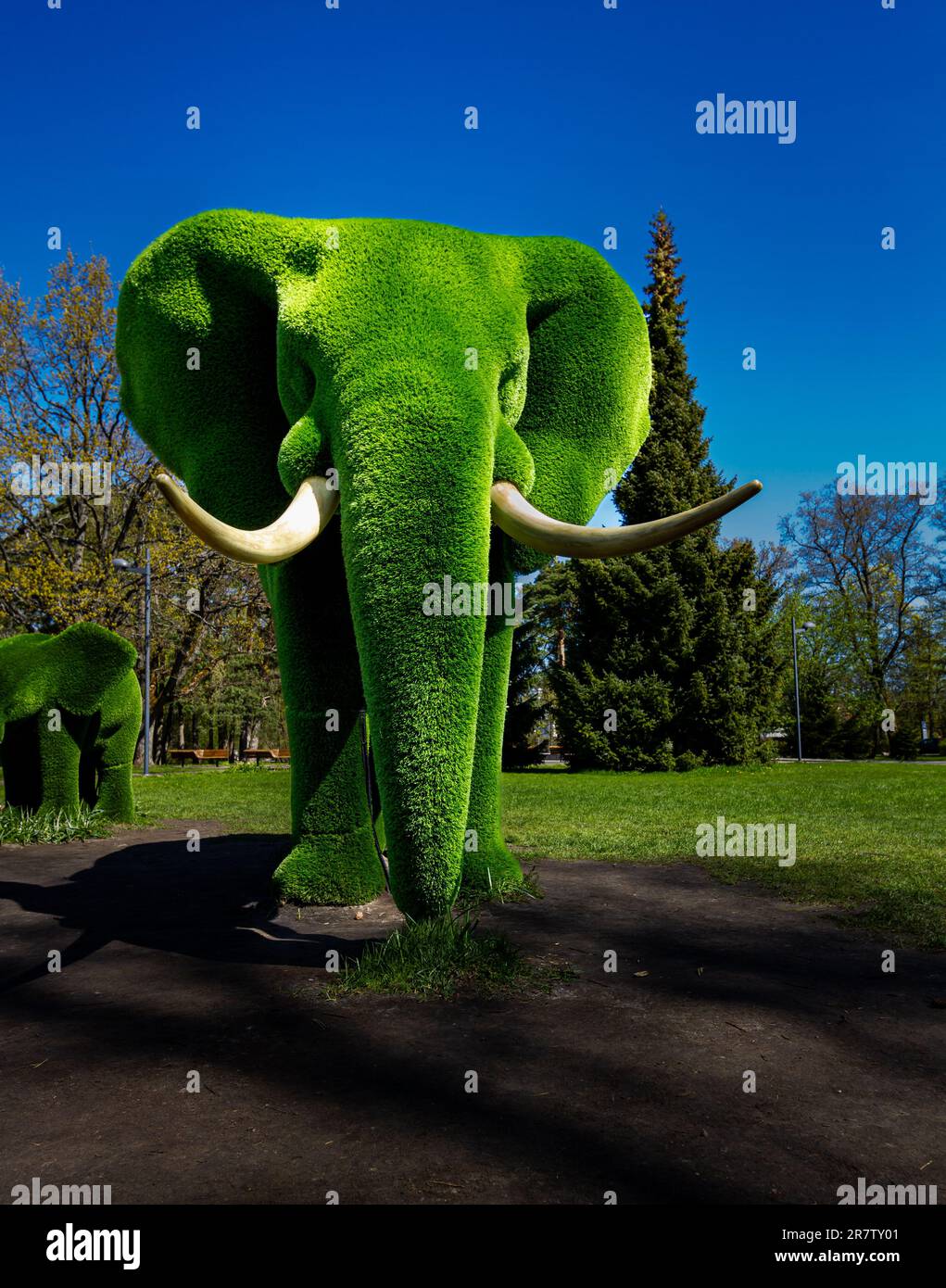Green elephant statue in park Stock Photo Alamy