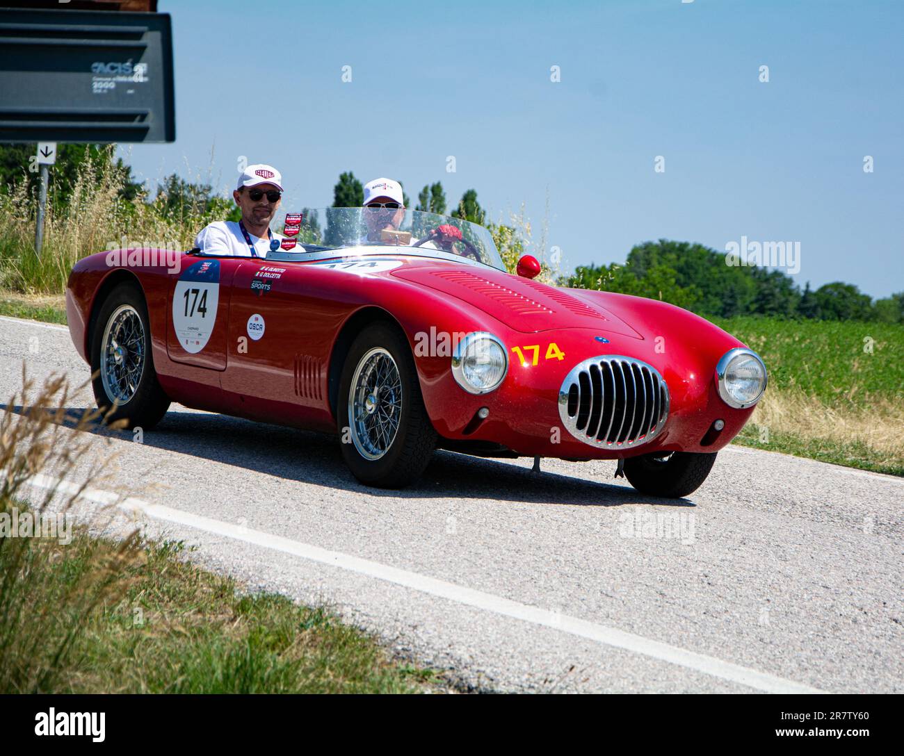 Two people in O.S.C.A. MT4 1100 2AD 1953 car during an old racing car ...