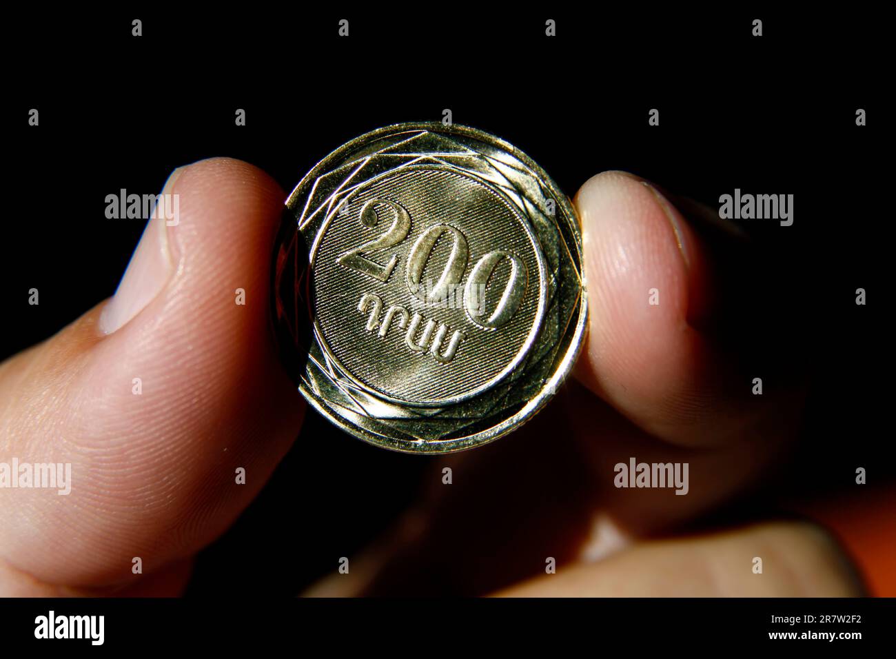 two hundred dram armenian coin between fingers armenian coin dram