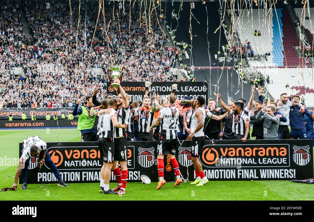 Grimsby celebrate promotion during the Vanarama National League play-off final match between Grimsby Town FC and Solihull Moors at The London Stadium, Stock Photo