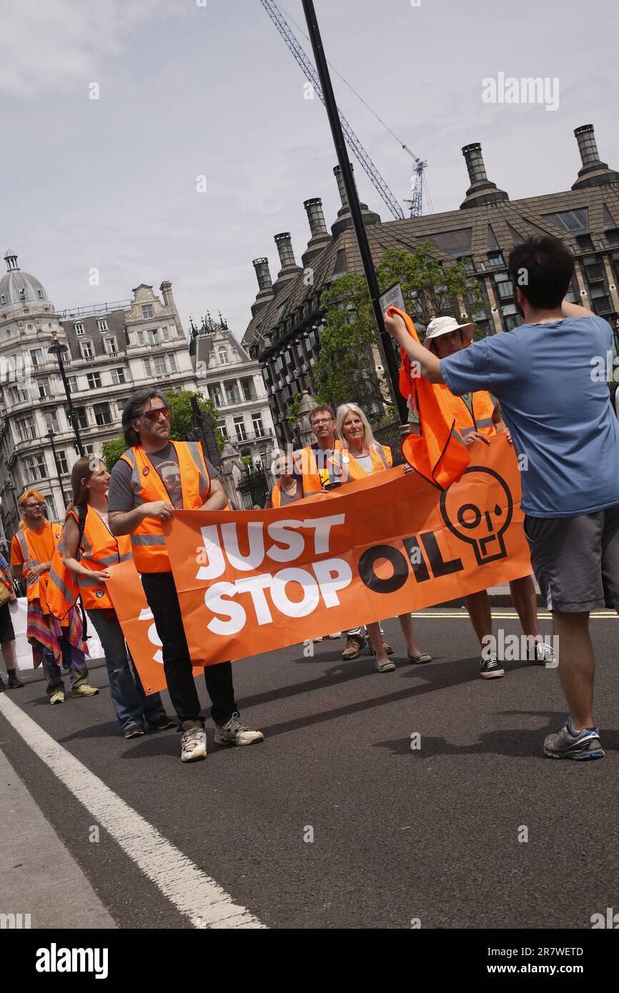 London, UK. 17/June/2023 Just Stop Oil Protests with a Slow March in Westinster. Campaign group Just Stop Oil held its weekly slow march from Parliament Square on Saturday. The march coincided with the royal birthday resulting in an increased police presence. After being threatened with arrests the group moved onto the kerb to continue its March. Credit: Roland Ravenhill/Alamy. Stock Photo